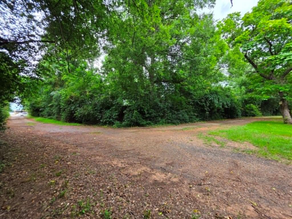 4514 West Loop 281 Longview, TX 75604 - Photo 12 of 36 Expansive wooded property featuring mature trees and a natural setting