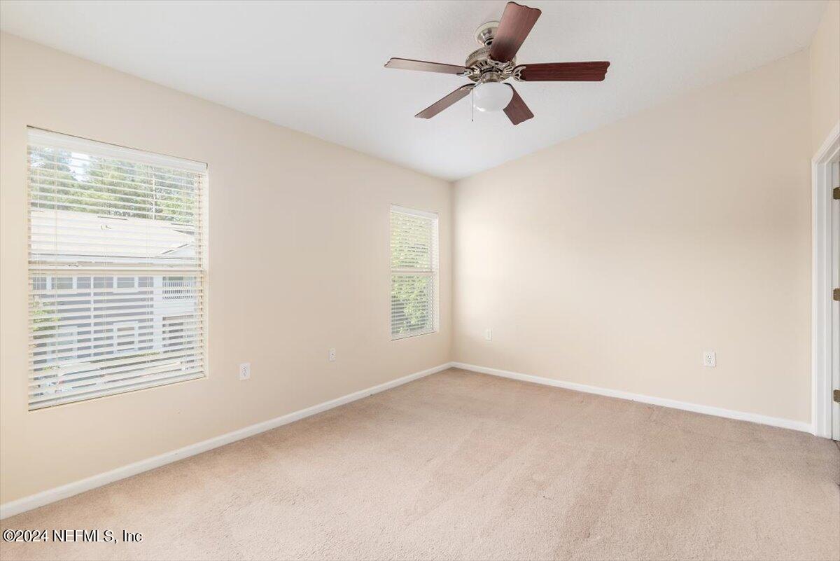 7920 Merrill Road, Unit 2013 Jacksonville, FL 32277 - Photo 15 of 21 a view of room with a ceiling fan and window