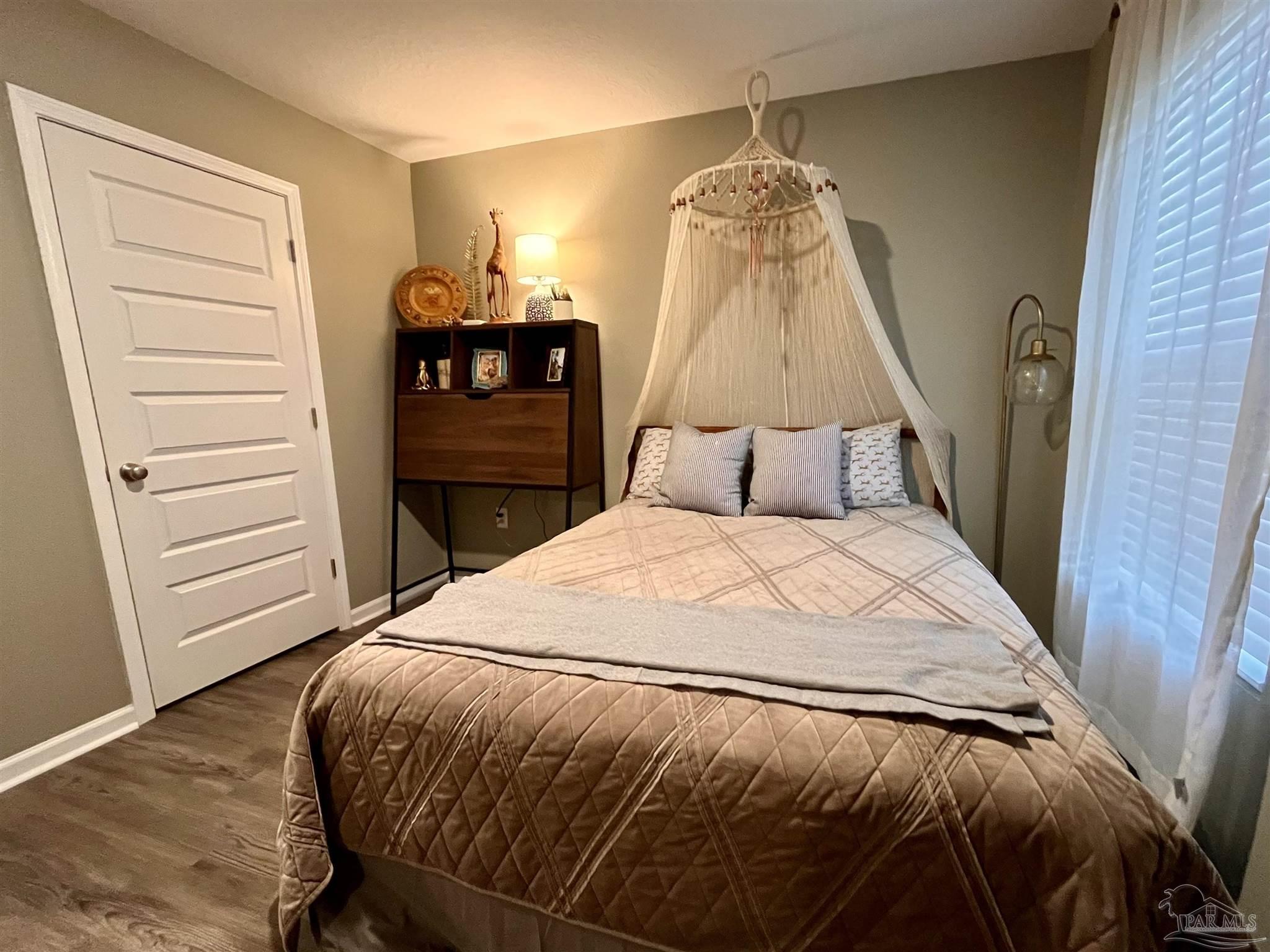 5375 Peach Drive Milton, FL 32571 - Photo 14 of 34 a bedroom with a bed and a closet
