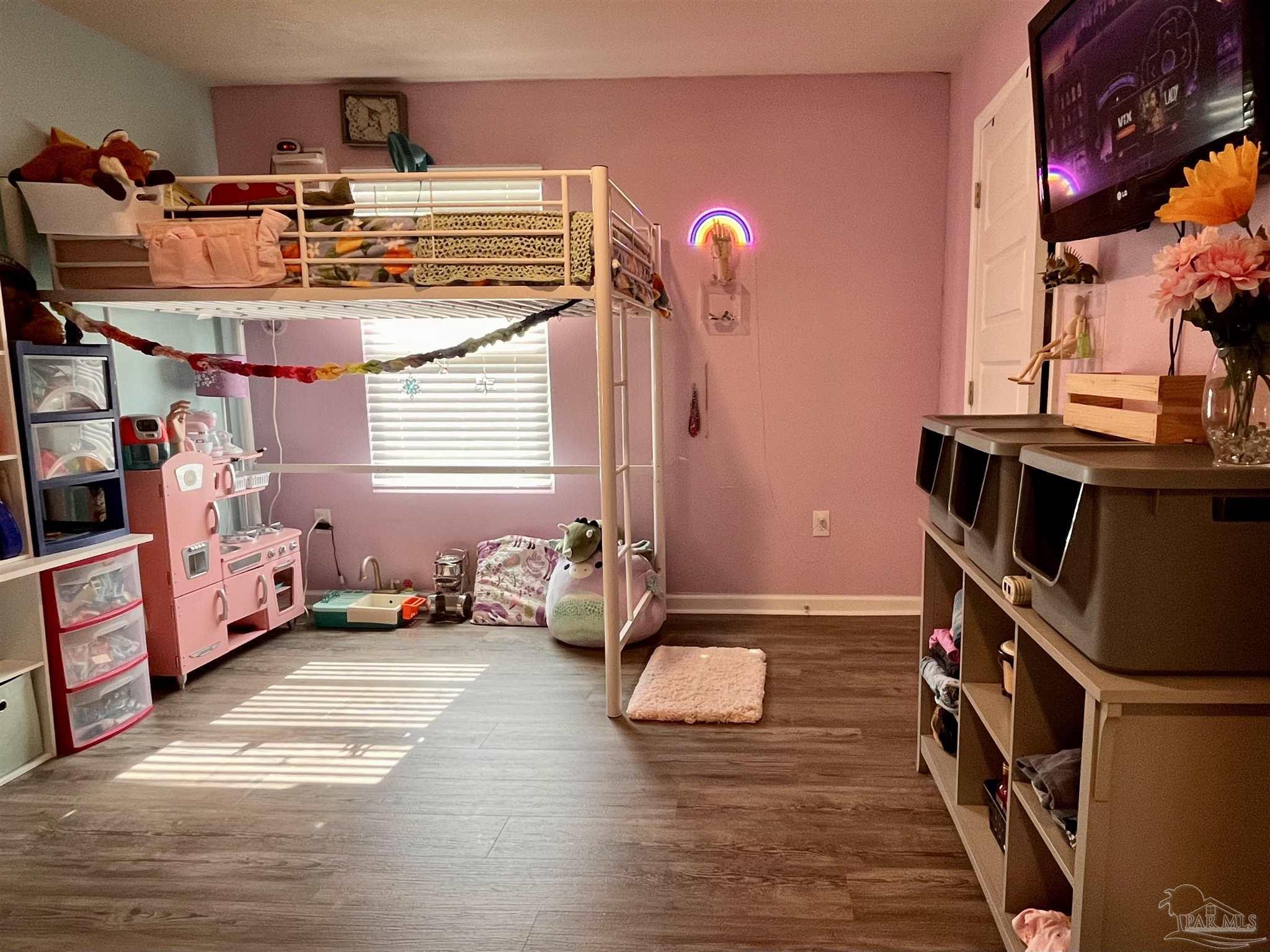 5375 Peach Drive Milton, FL 32571 - Photo 23 of 34 a view of living room filled with furniture and toys