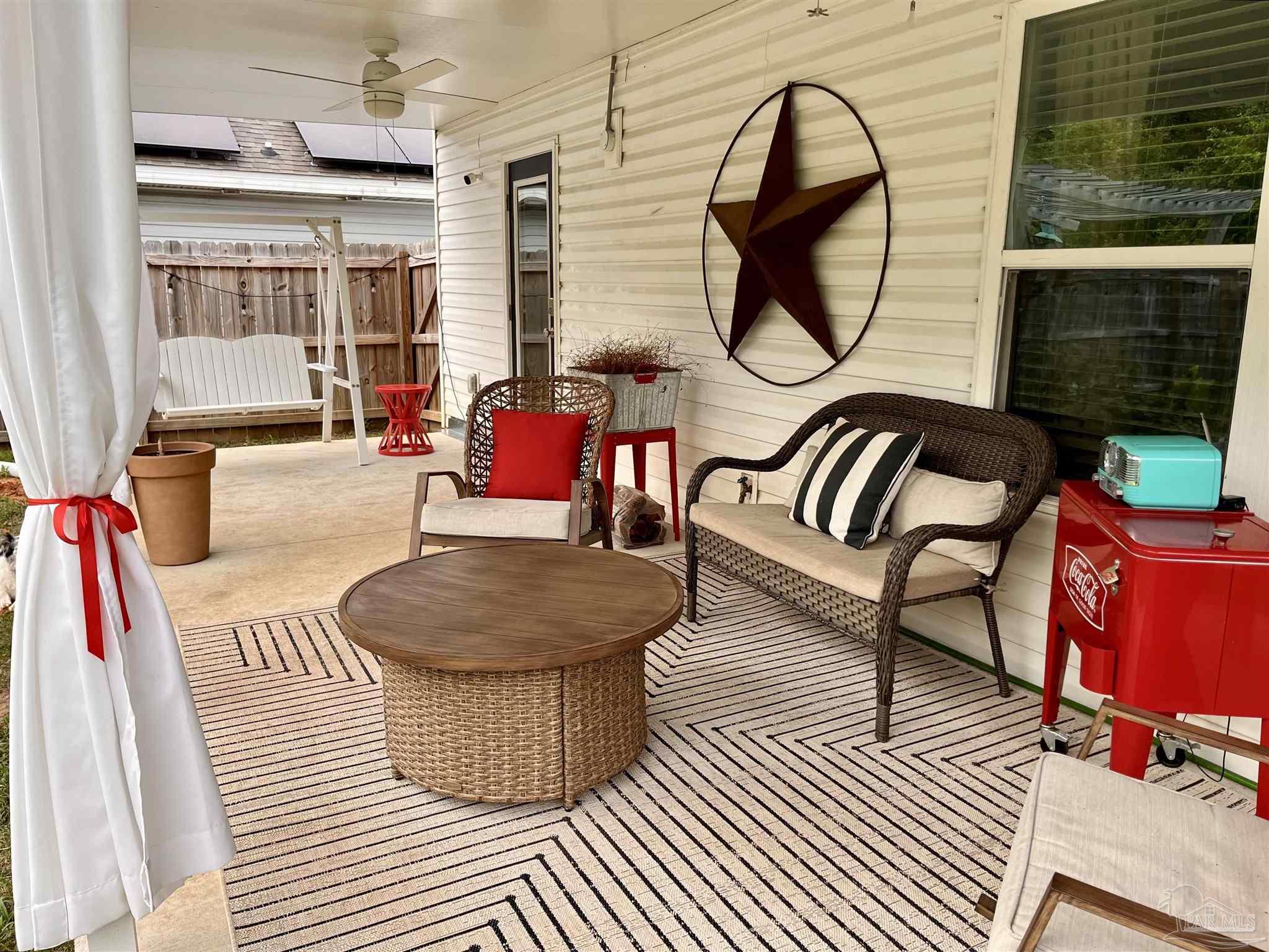 5375 Peach Drive Milton, FL 32571 - Photo 28 of 34 a living room with furniture a rug and a window