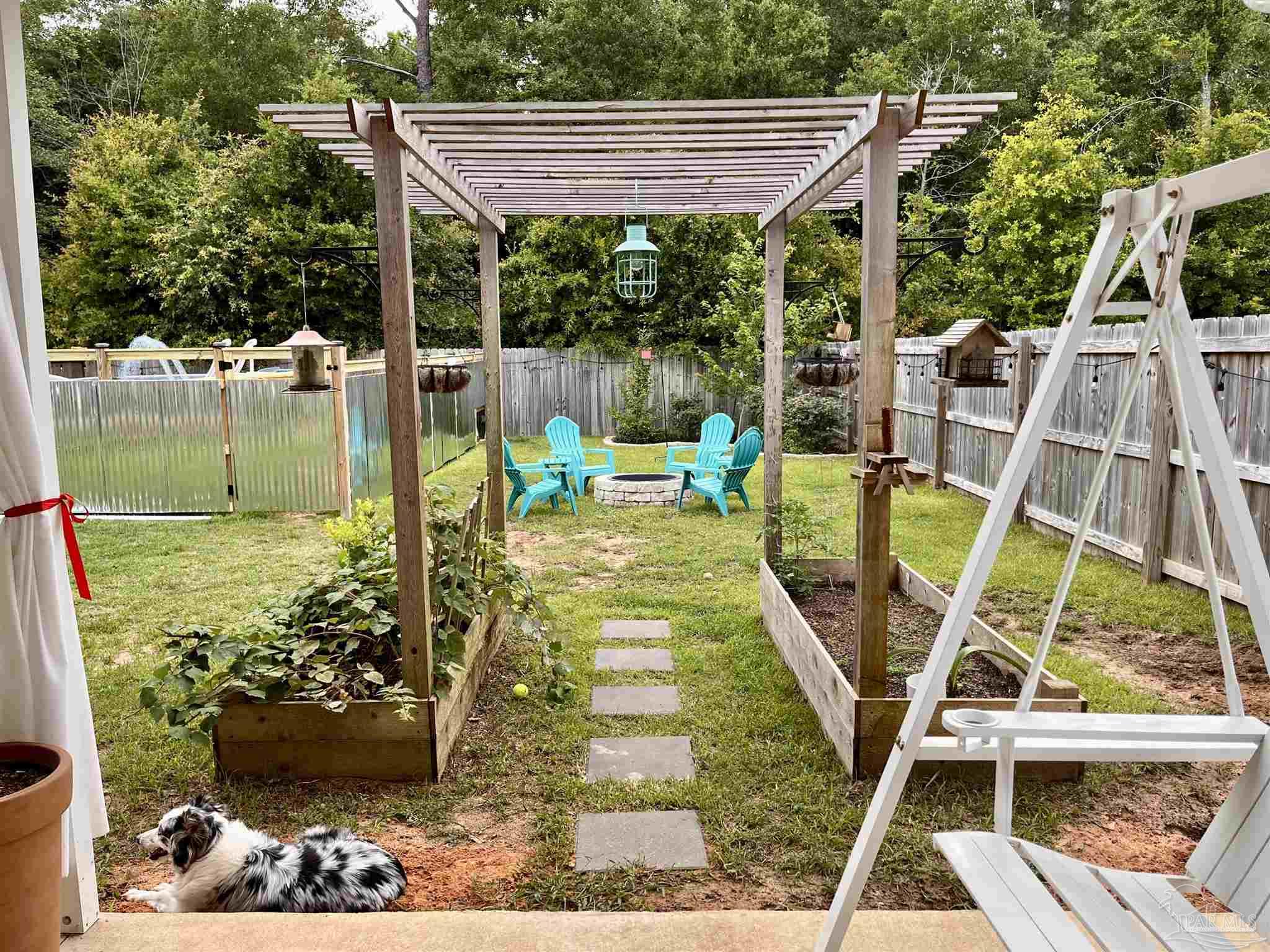 5375 Peach Drive Milton, FL 32571 - Photo 29 of 34 a view of a chairs and tables in the patio