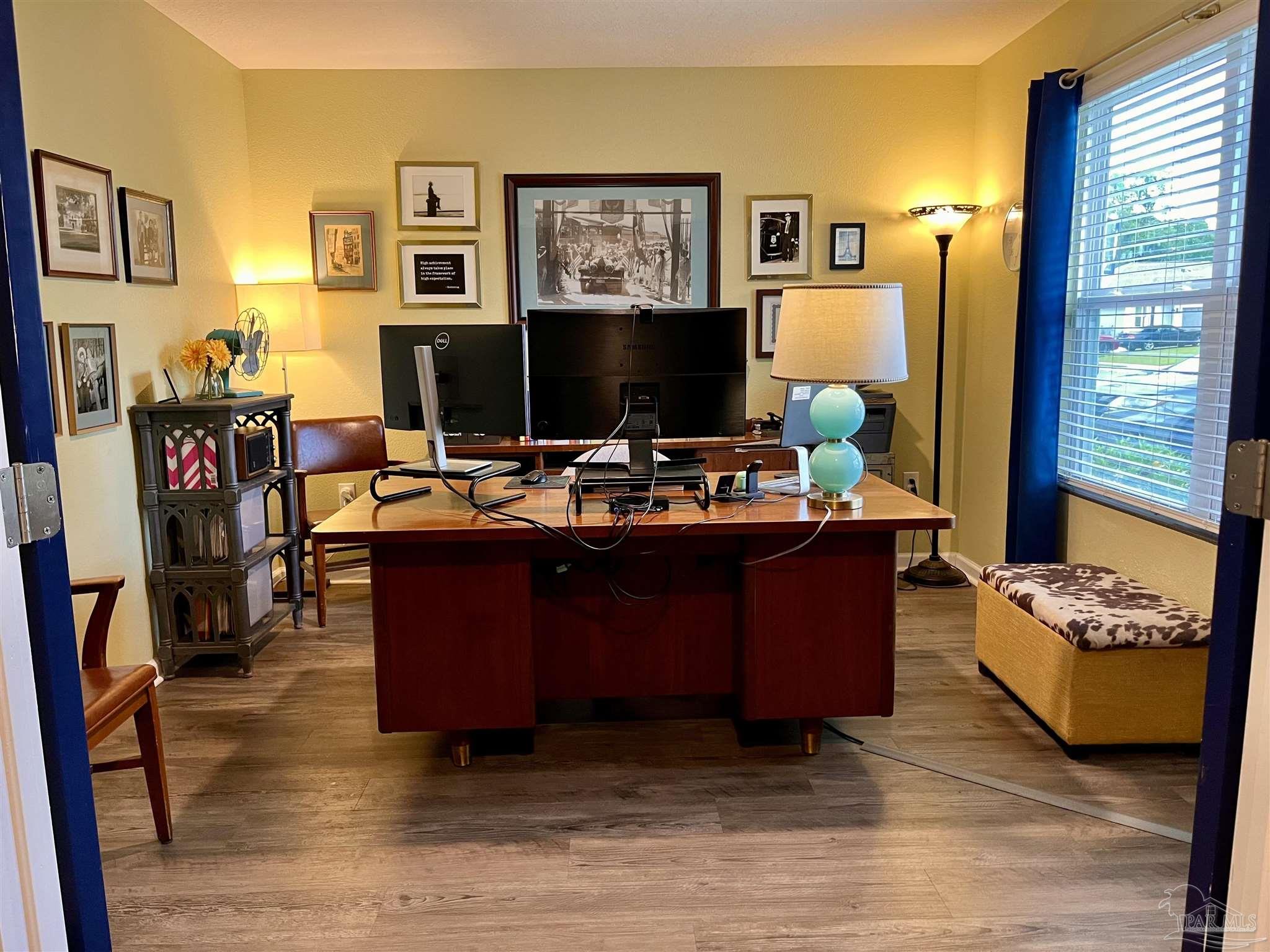 5375 Peach Drive Milton, FL 32571 - Photo 4 of 34 a living room with furniture and a flat screen tv