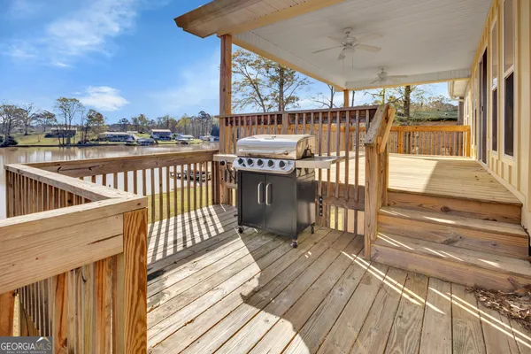 a view of a house with a yard patio and sitting area