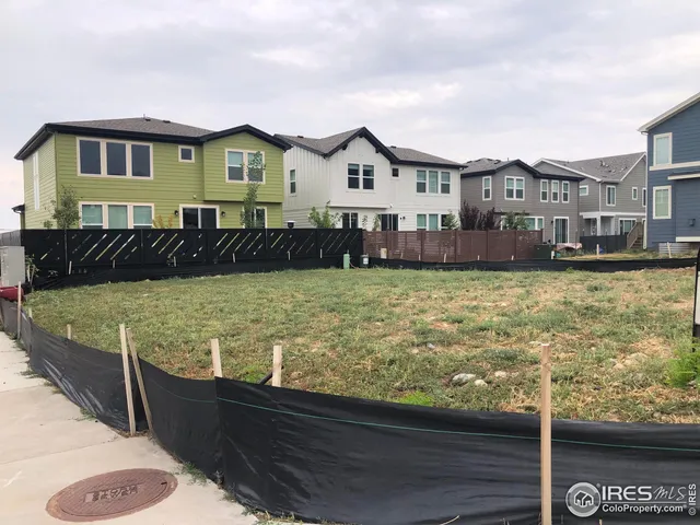 a view of a house with backyard pool and sitting area