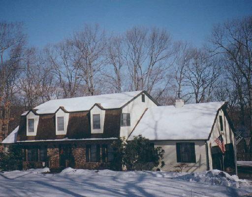 26 Cornell Road New Fairfield, CT 06812 - Photo 1 of 1 a view of a white house with large windows