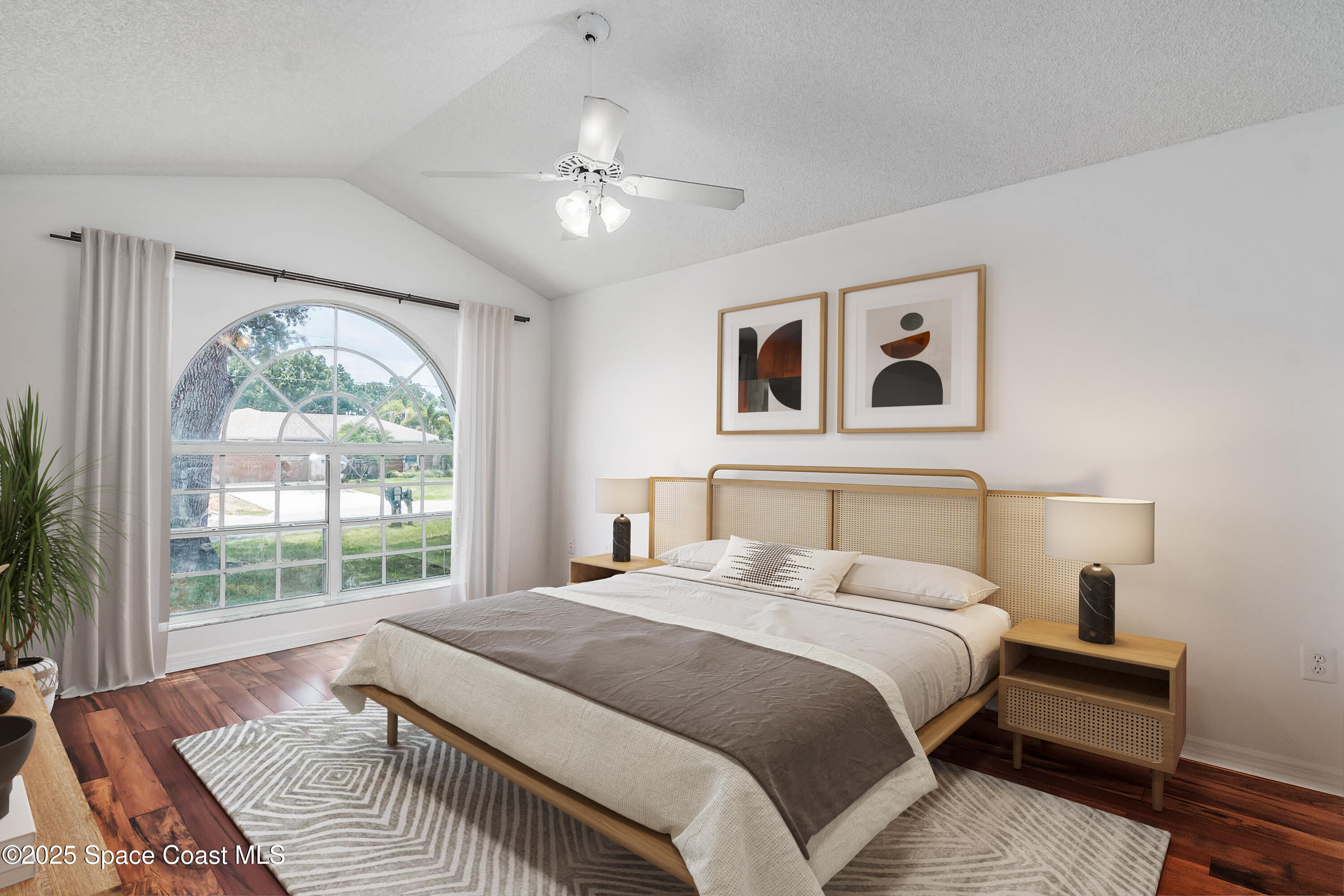 6760 Cairo Road Cocoa, FL 32927 - Photo 14 of 51 a bedroom with a large bed and a window