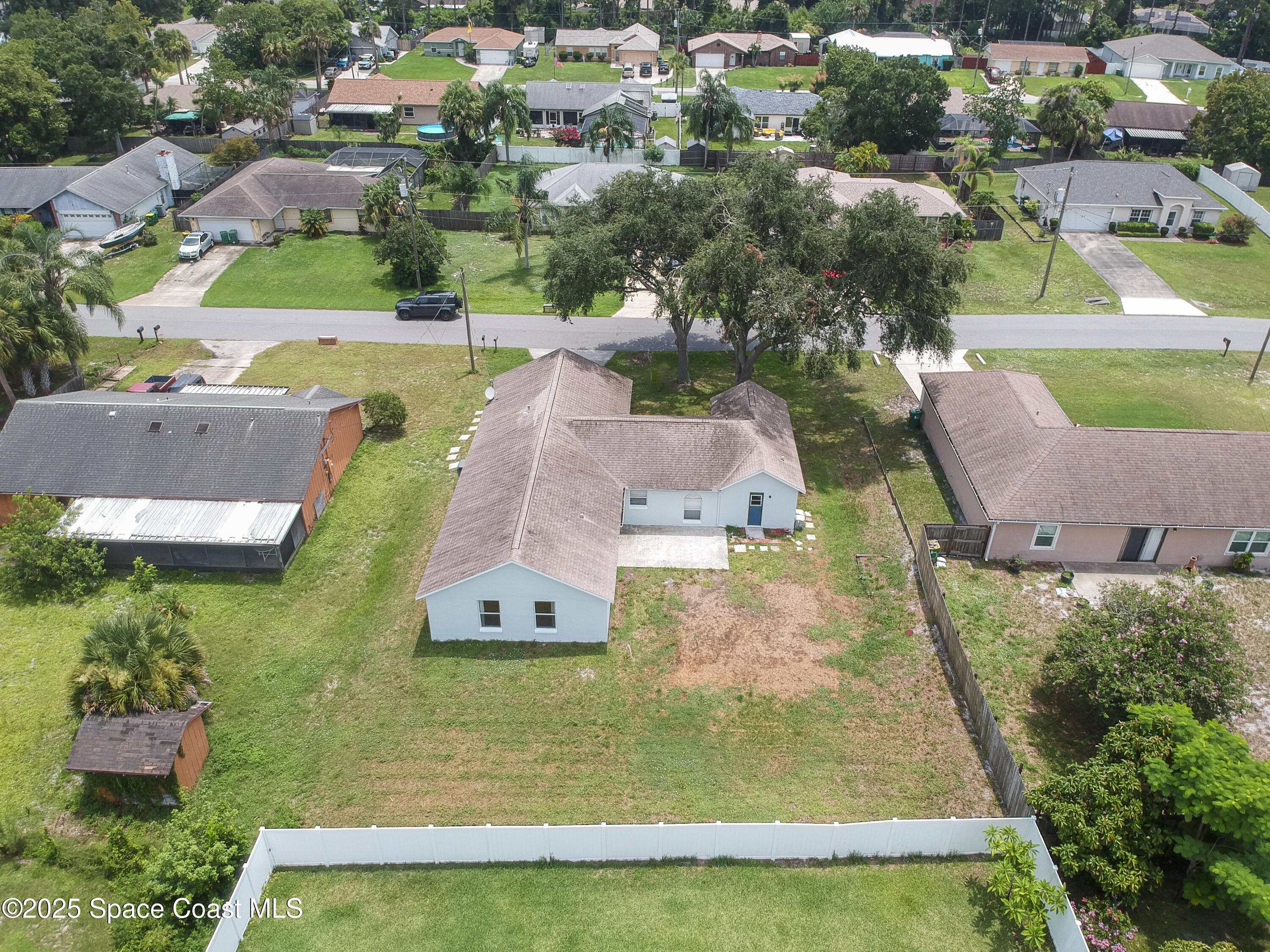 6760 Cairo Road Cocoa, FL 32927 - Photo 2 of 51 an aerial view of residential houses with outdoor space and swimming pool