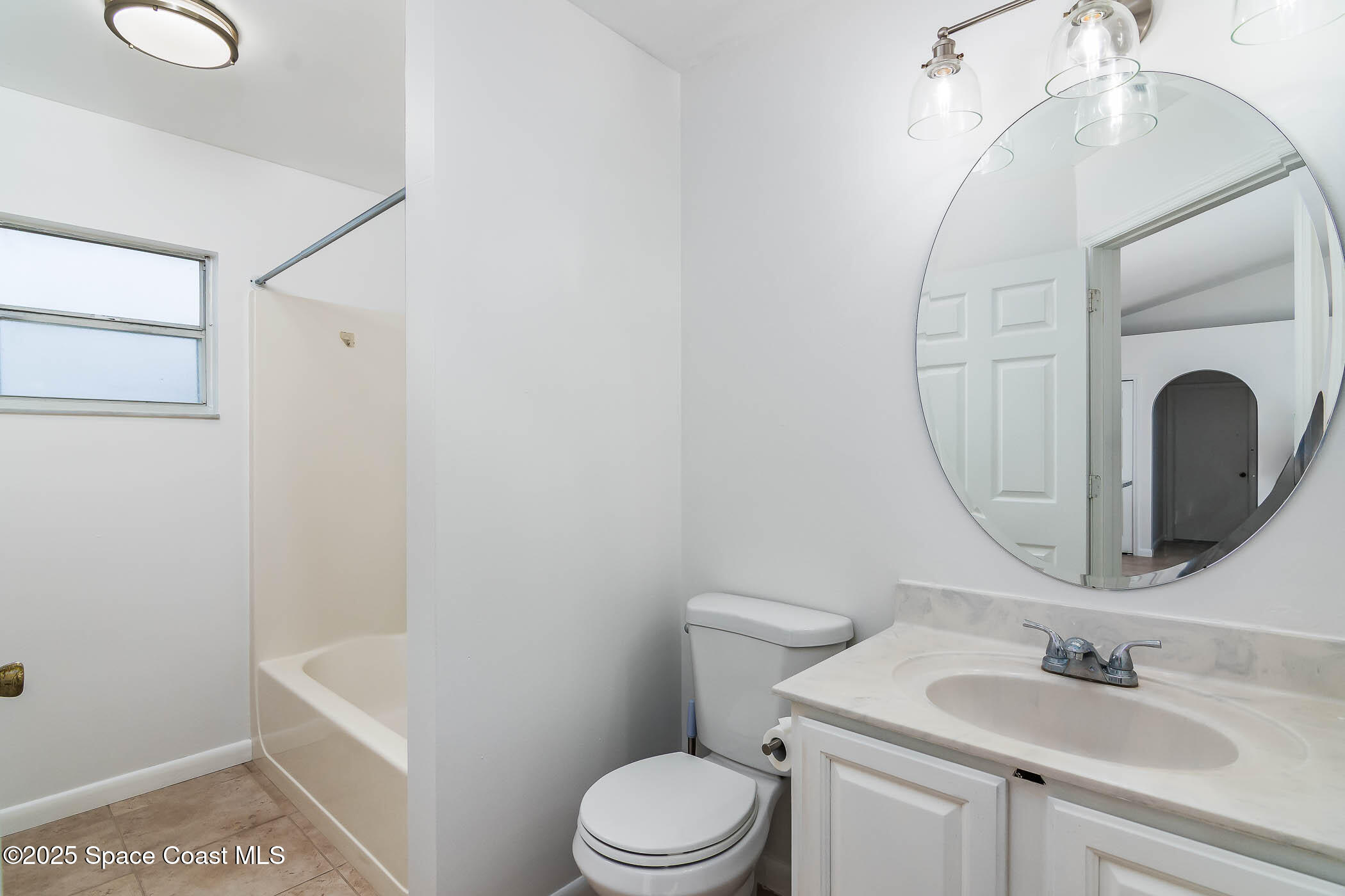 6760 Cairo Road Cocoa, FL 32927 - Photo 21 of 51 a bathroom with a sink vanity granite and toilet