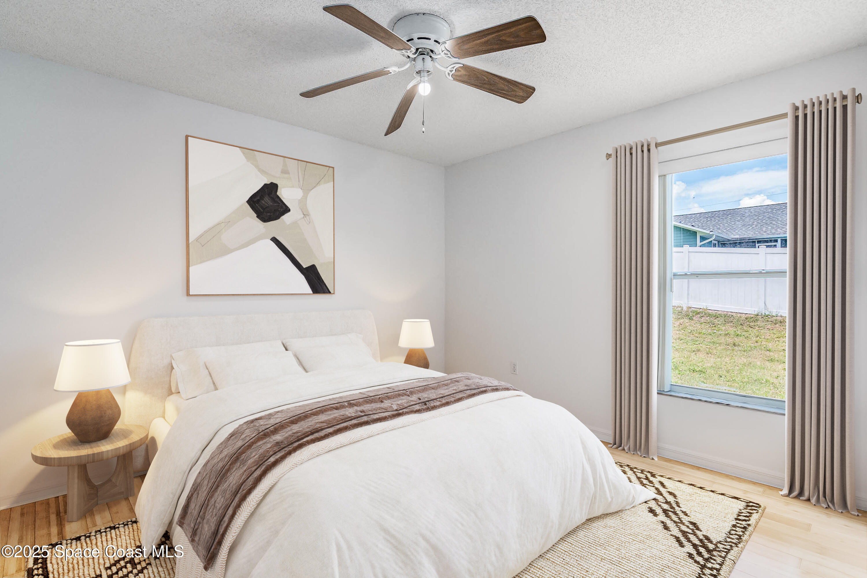 6760 Cairo Road Cocoa, FL 32927 - Photo 22 of 51 a bedroom with a bed and a window