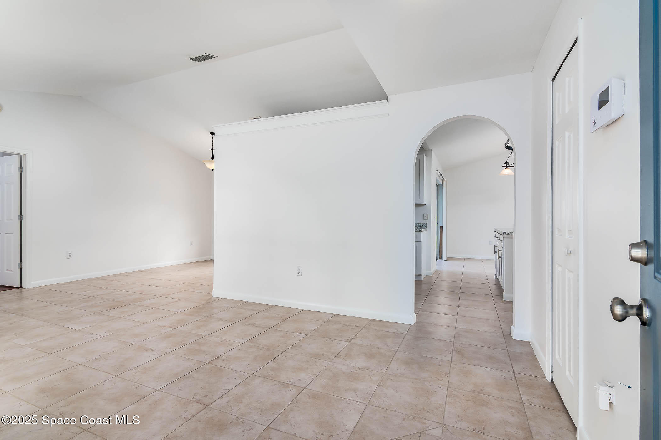 6760 Cairo Road Cocoa, FL 32927 - Photo 27 of 51 a view of a hallway with wooden floor
