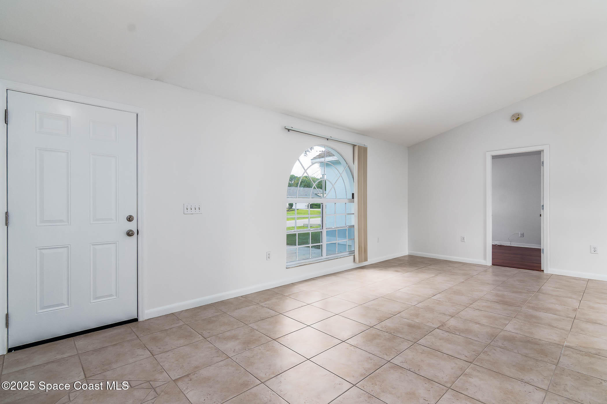 6760 Cairo Road Cocoa, FL 32927 - Photo 28 of 51 a view of an empty room with a window
