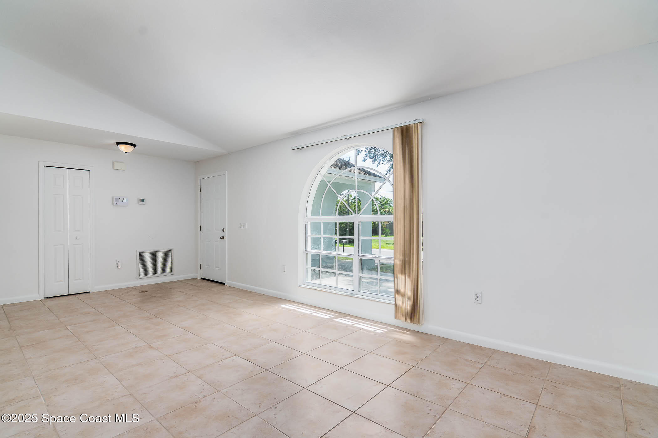6760 Cairo Road Cocoa, FL 32927 - Photo 29 of 51 an empty room with windows