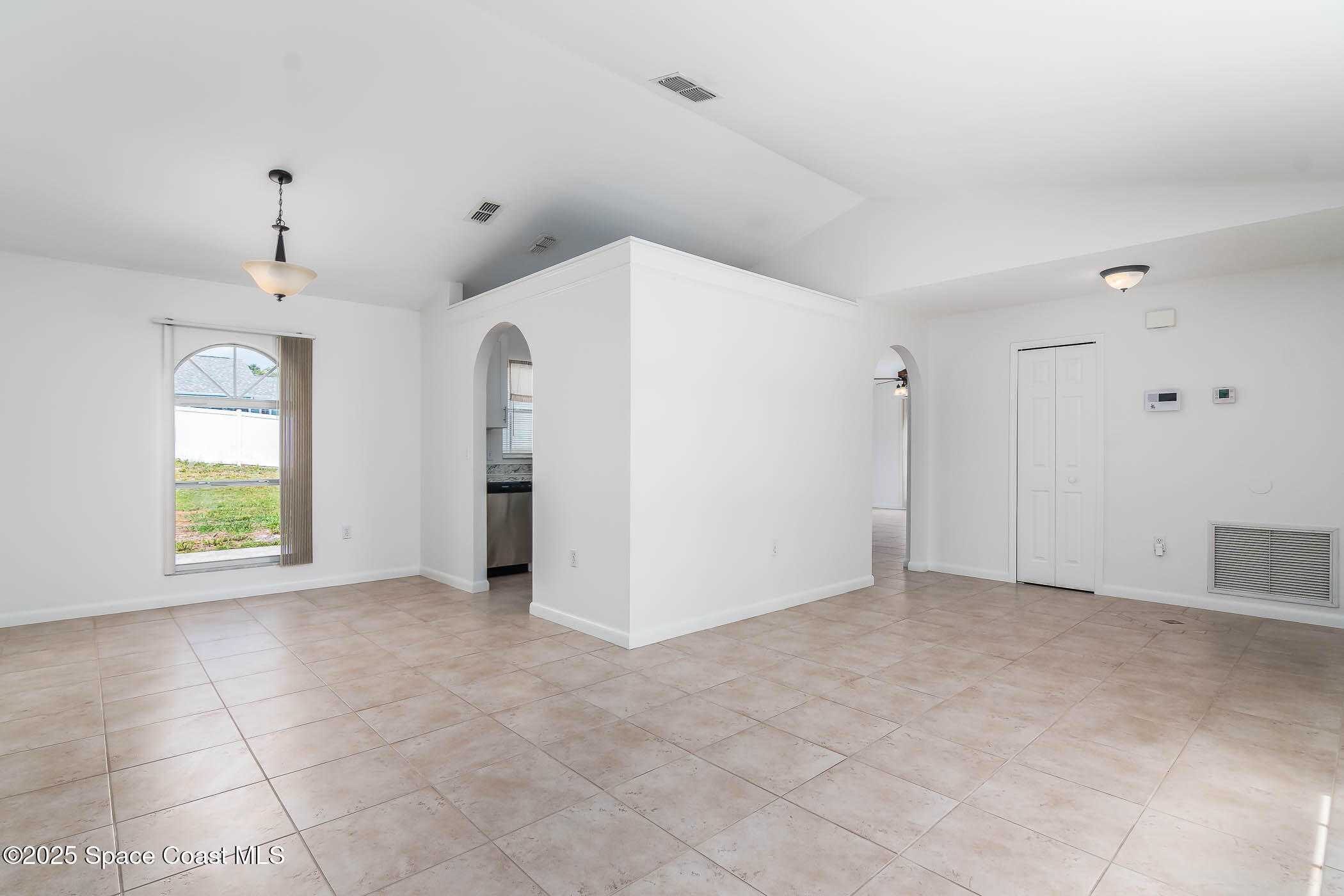 6760 Cairo Road Cocoa, FL 32927 - Photo 30 of 51 a view of an empty room with a window