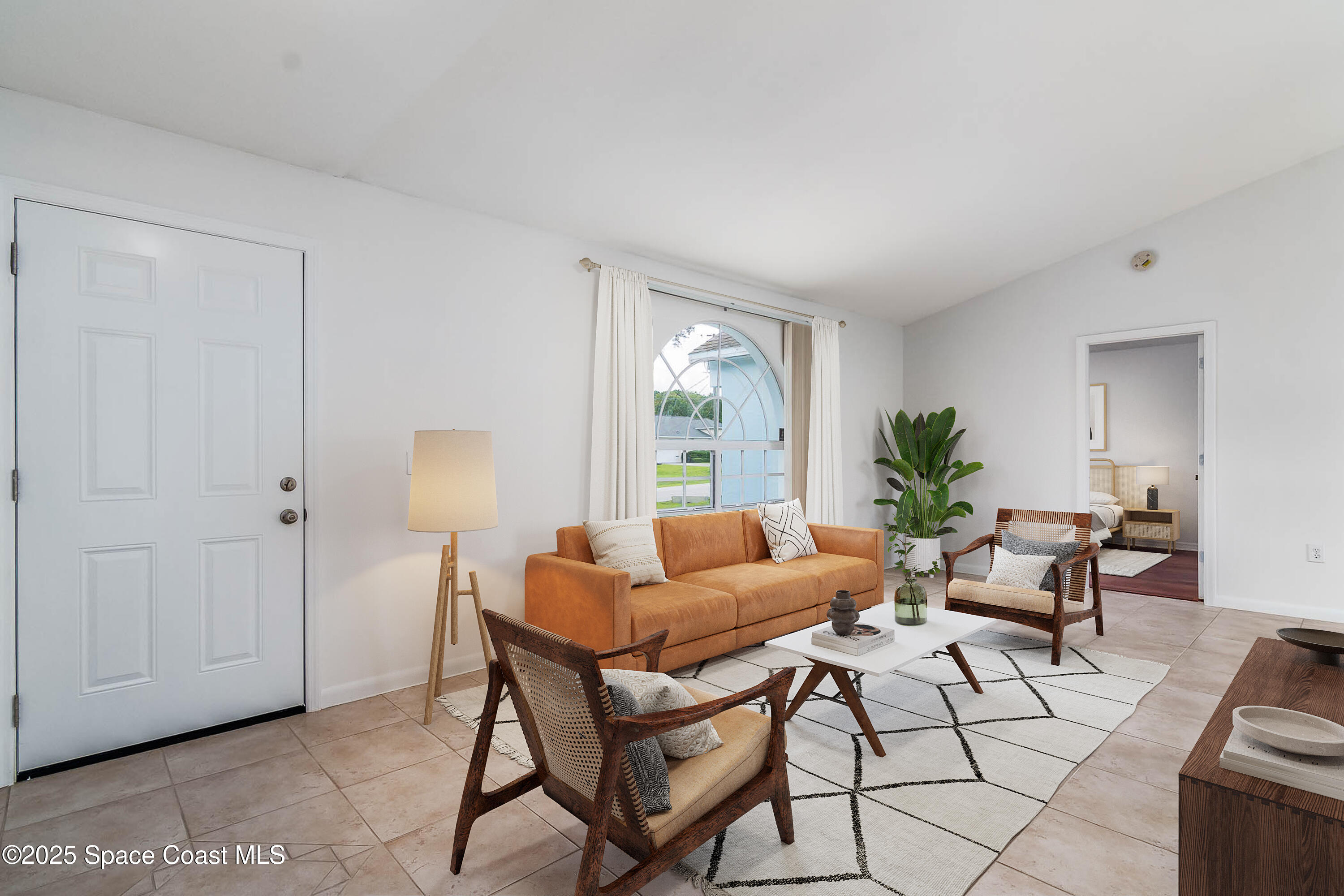 6760 Cairo Road Cocoa, FL 32927 - Photo 3 of 51 a living room with furniture and a potted plant
