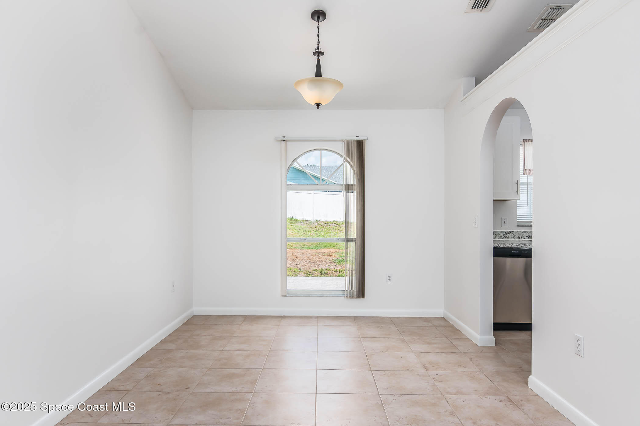 6760 Cairo Road Cocoa, FL 32927 - Photo 31 of 51 a view of an empty room with a window