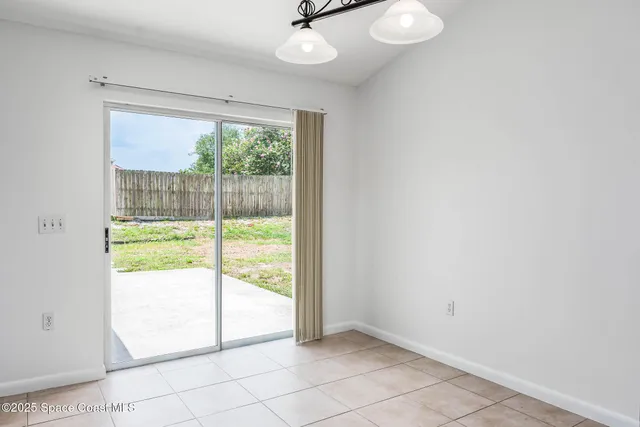 a view of a kitchen counter space and a chandelier