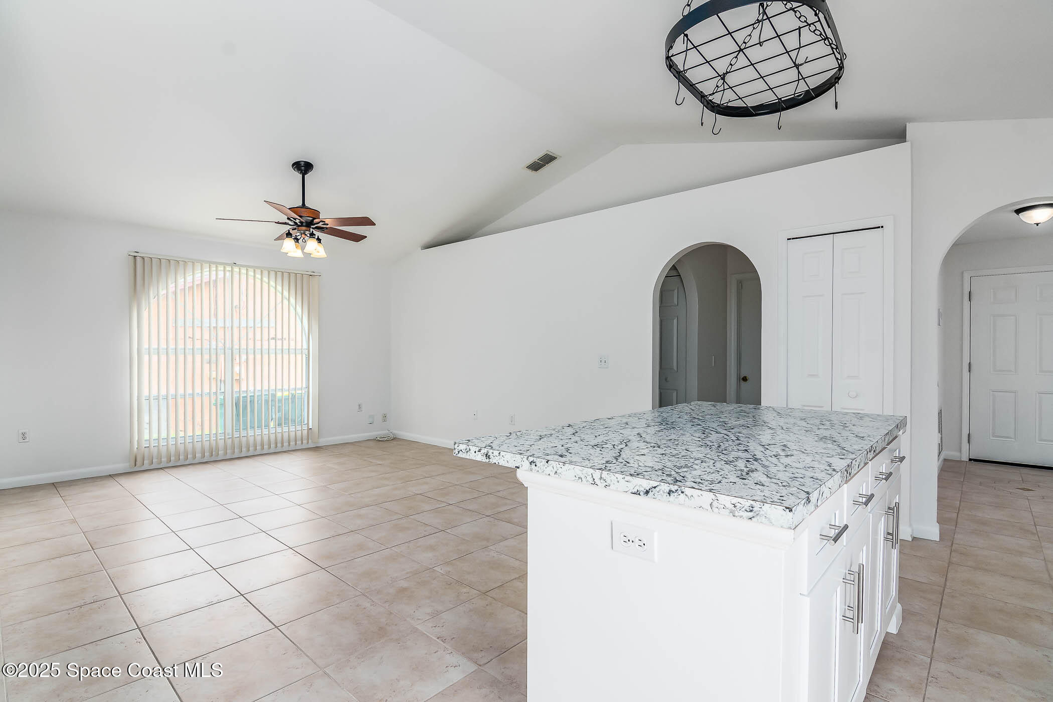 6760 Cairo Road Cocoa, FL 32927 - Photo 33 of 51 a view of a kitchen counter space and a chandelier