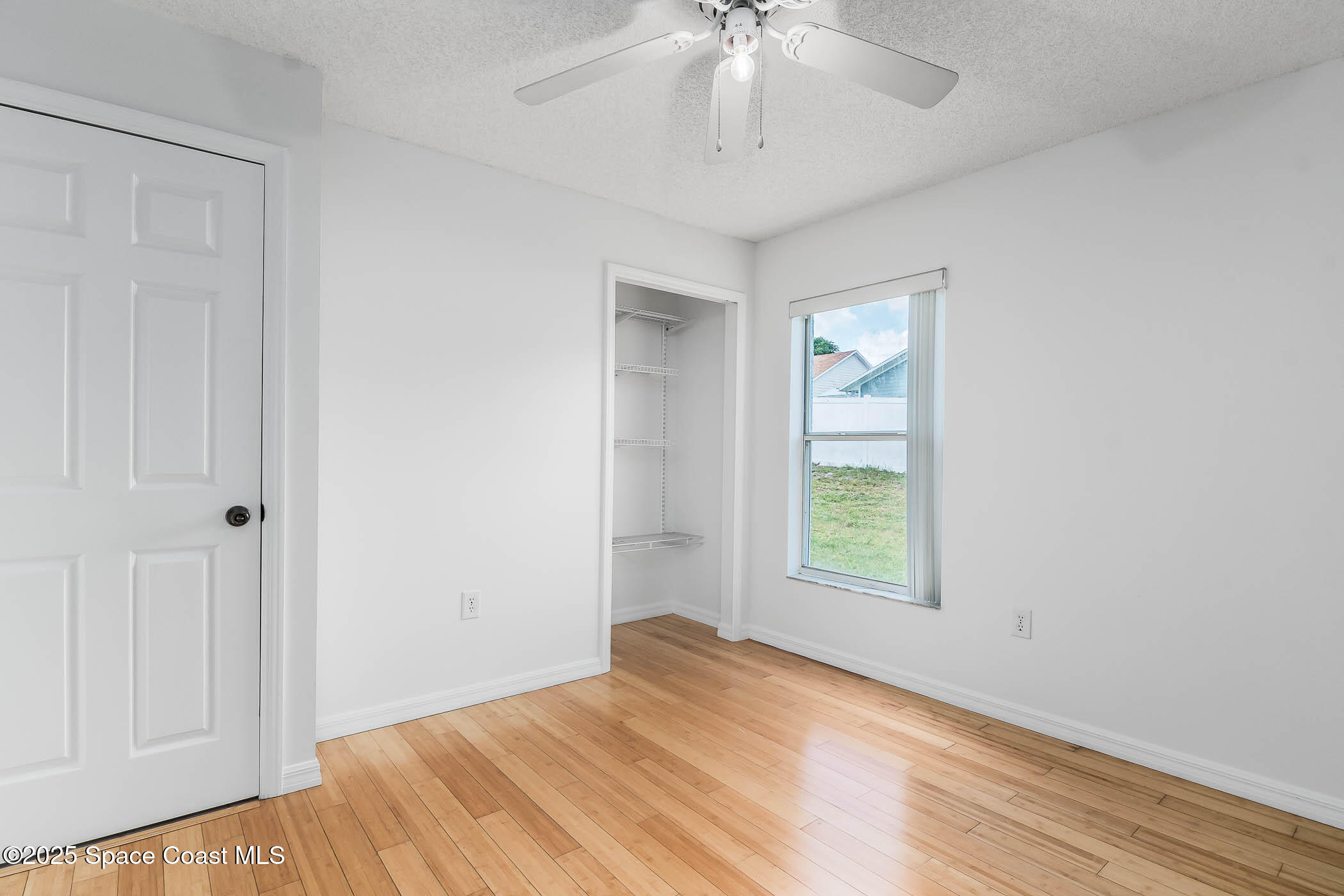 6760 Cairo Road Cocoa, FL 32927 - Photo 43 of 51 wooden floor in an empty room with a window