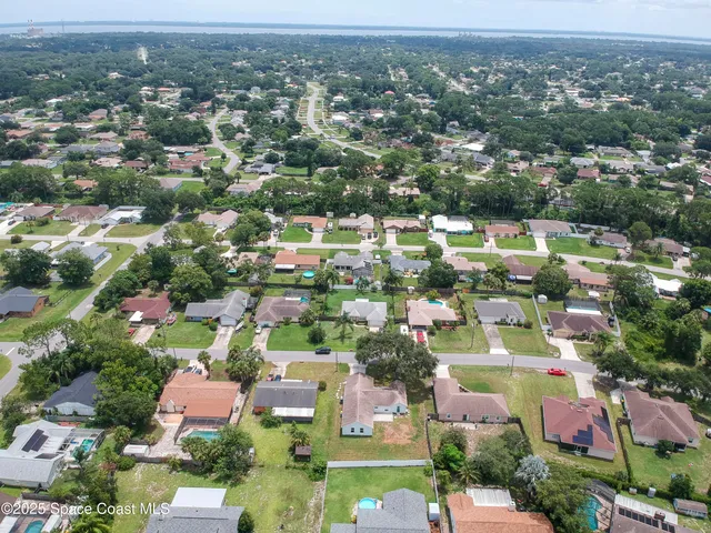 an aerial view of a city with lots of residential buildings