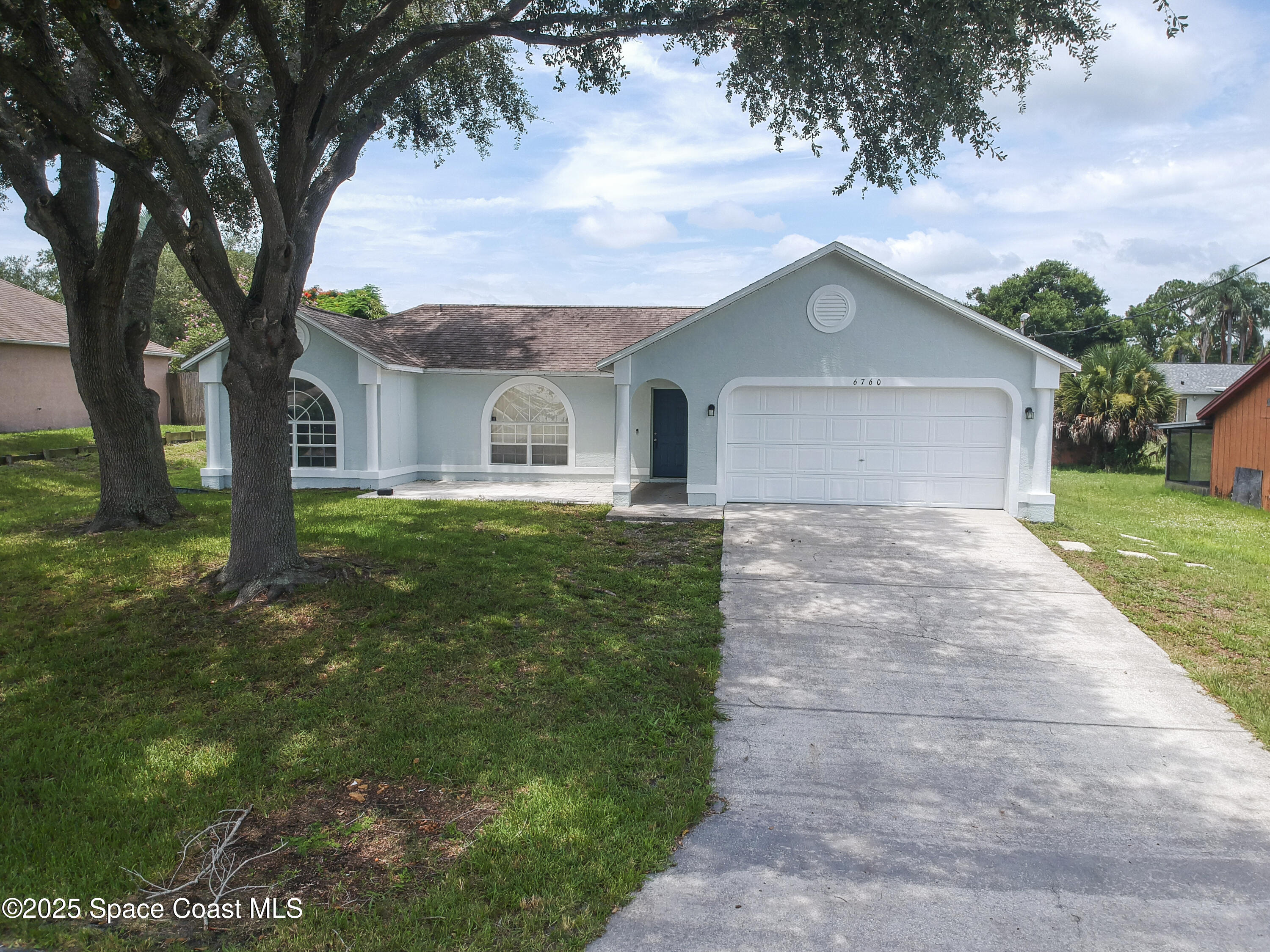 6760 Cairo Road Cocoa, FL 32927 - Photo 50 of 51 a front view of a house with garden