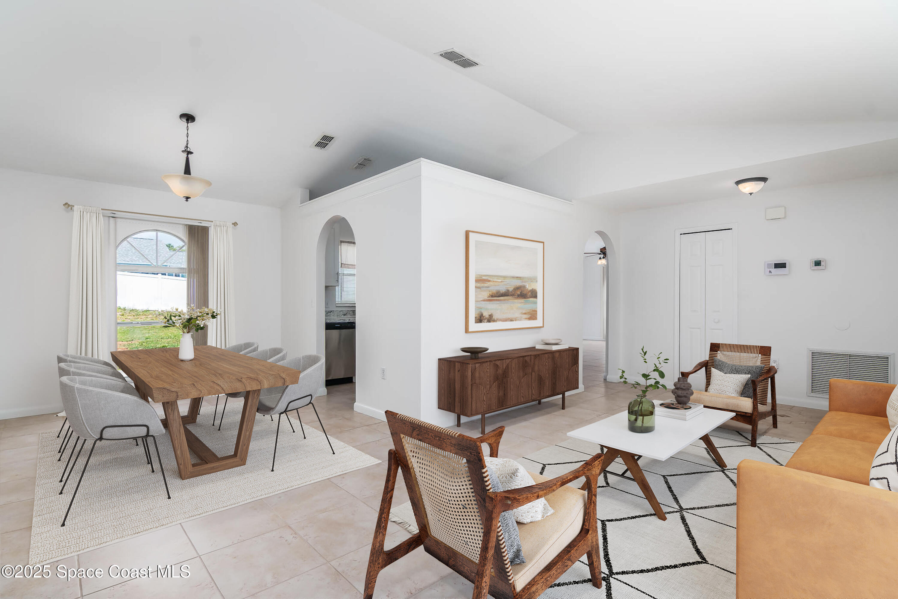 6760 Cairo Road Cocoa, FL 32927 - Photo 5 of 51 a living room with furniture a table and a window