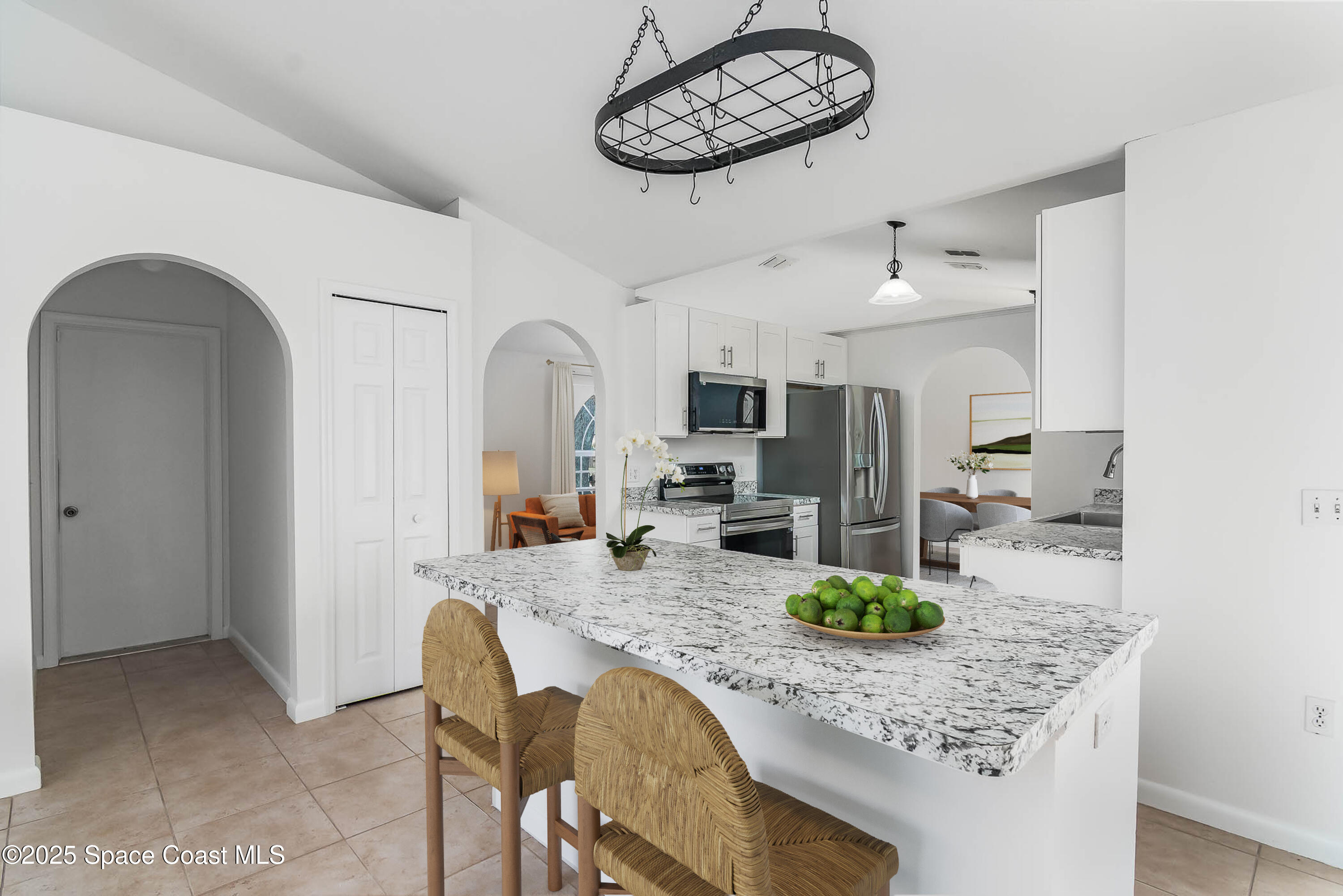 6760 Cairo Road Cocoa, FL 32927 - Photo 10 of 51 a kitchen with stainless steel appliances granite countertop a sink refrigerator and cabinets