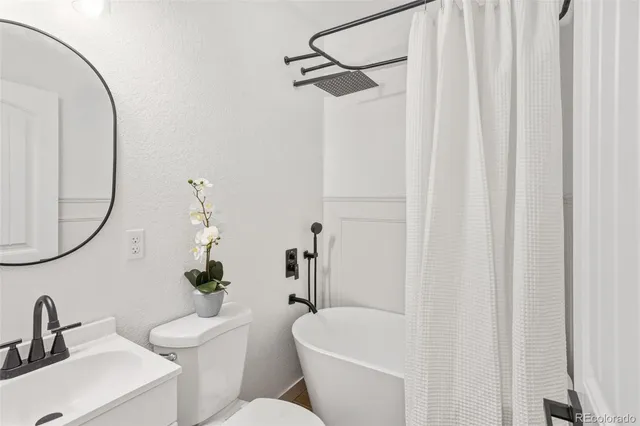 a bathroom with a toilet and a sink