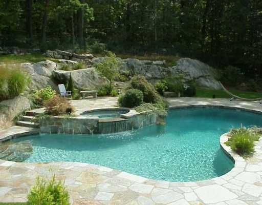 Undisclosed Address Greenwich, CT 06831 - Photo 3 of 3 a view of a lake with a building in the background