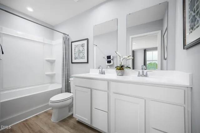 a spacious bedroom with a bed and a window