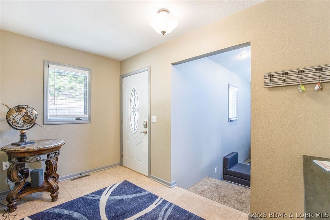 472 Jupiter Road Camdenton, MO 65020 - Photo 15 of 59 The foyer entrance is large with 3 bedrooms and 2