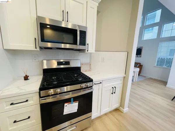 a view of kitchen and dining area with furniture