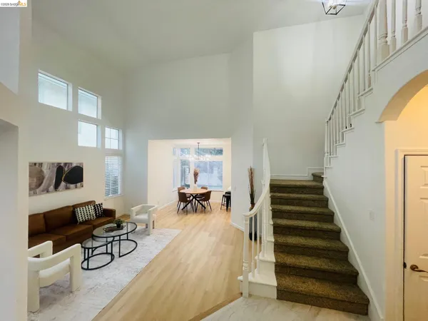 a living room with furniture and a table