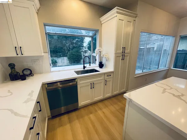 a bathroom with a sink a toilet a mirror and vanity