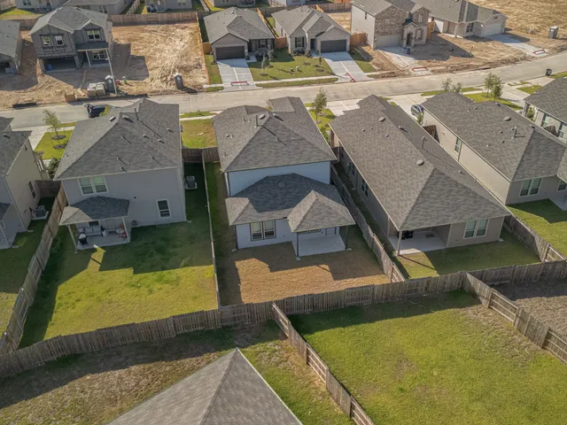 an aerial view of a house with swimming pool