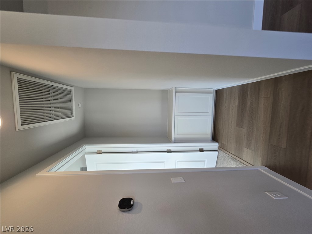852 Weston Ridge Street Henderson, NV 89011 - Photo 13 of 28 Smart home ready, this room offers functional built-in storage and sleek flooring.