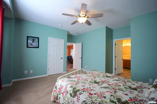 a bedroom with bed and a window