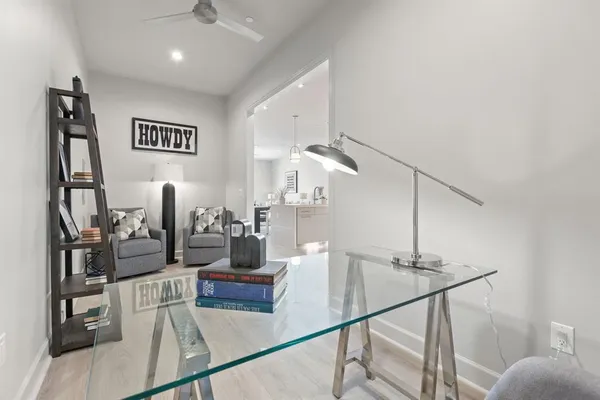 a kitchen with stainless steel appliances kitchen island granite countertop a stove a sink a refrigerator and a fireplace