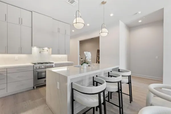 a kitchen with a stove and a sink