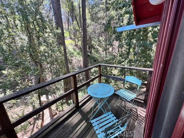 a view of balcony with wooden floor
