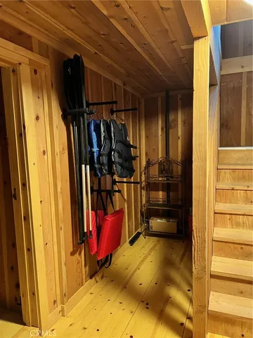 a view of walk in closet with clothes