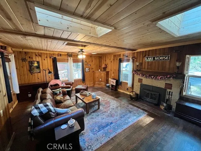 a living room with furniture a fireplace and a table