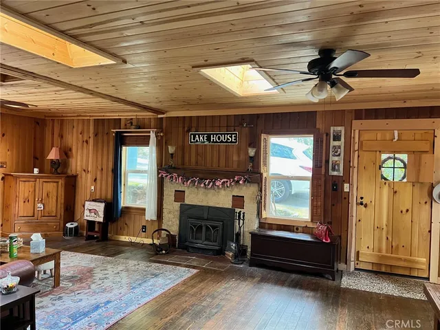a view of a livingroom with furniture and a fireplace