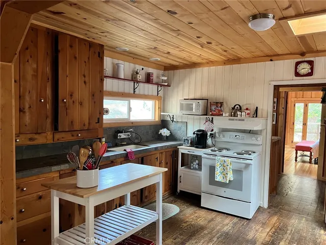 a kitchen with a stove and a refrigerator