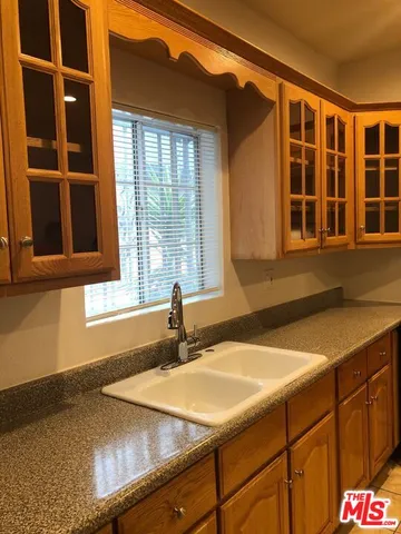 a kitchen with a sink and a window
