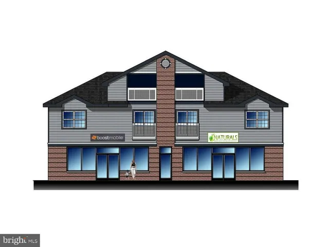 a kitchen with stainless steel appliances kitchen island granite countertop a stove and a microwave