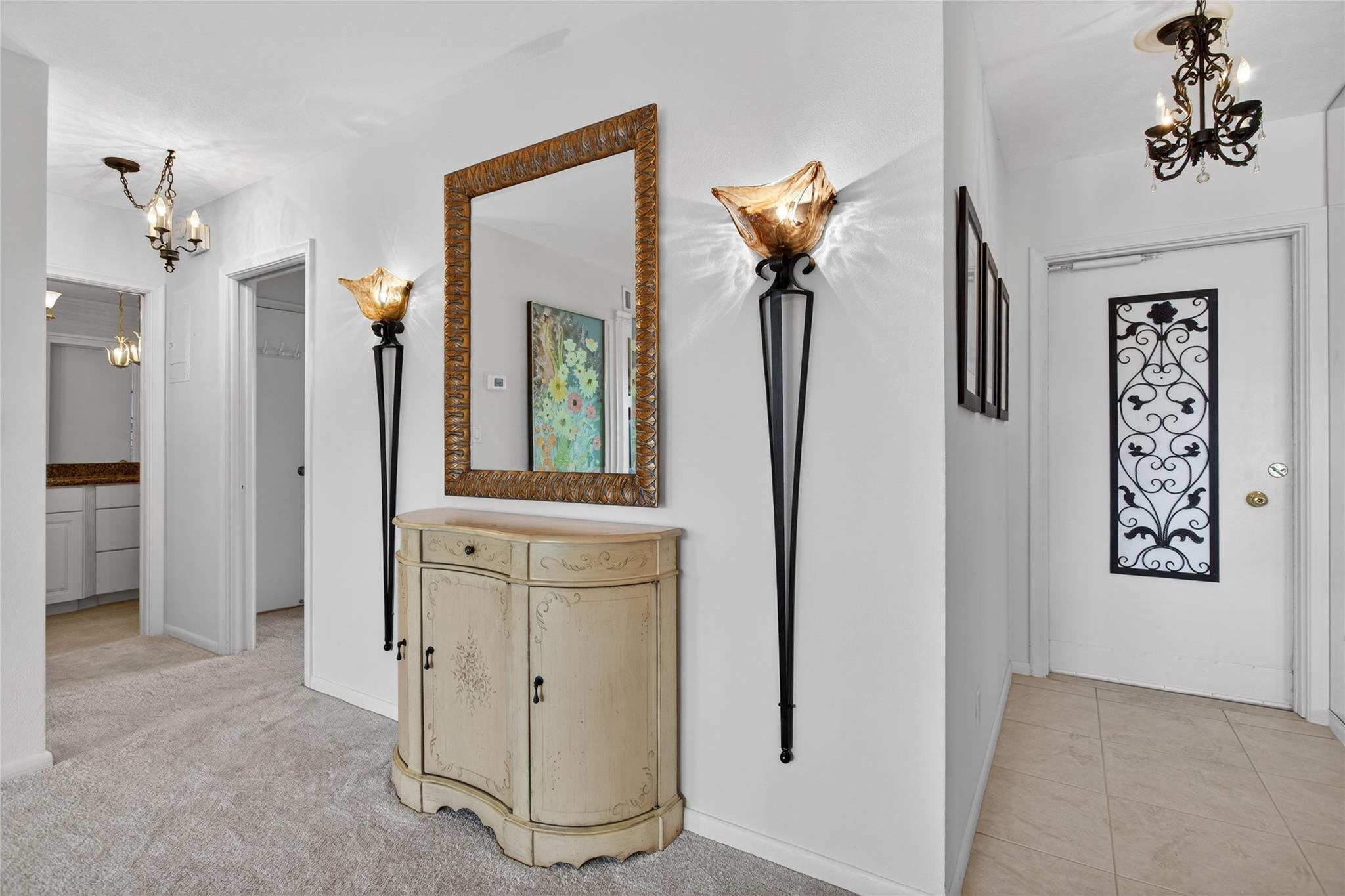 1001 North Riverside Drive, Unit 305 Pompano Beach, FL 33062 - Photo 21 of 44 a view of a hallway with closet and a chandelier fan