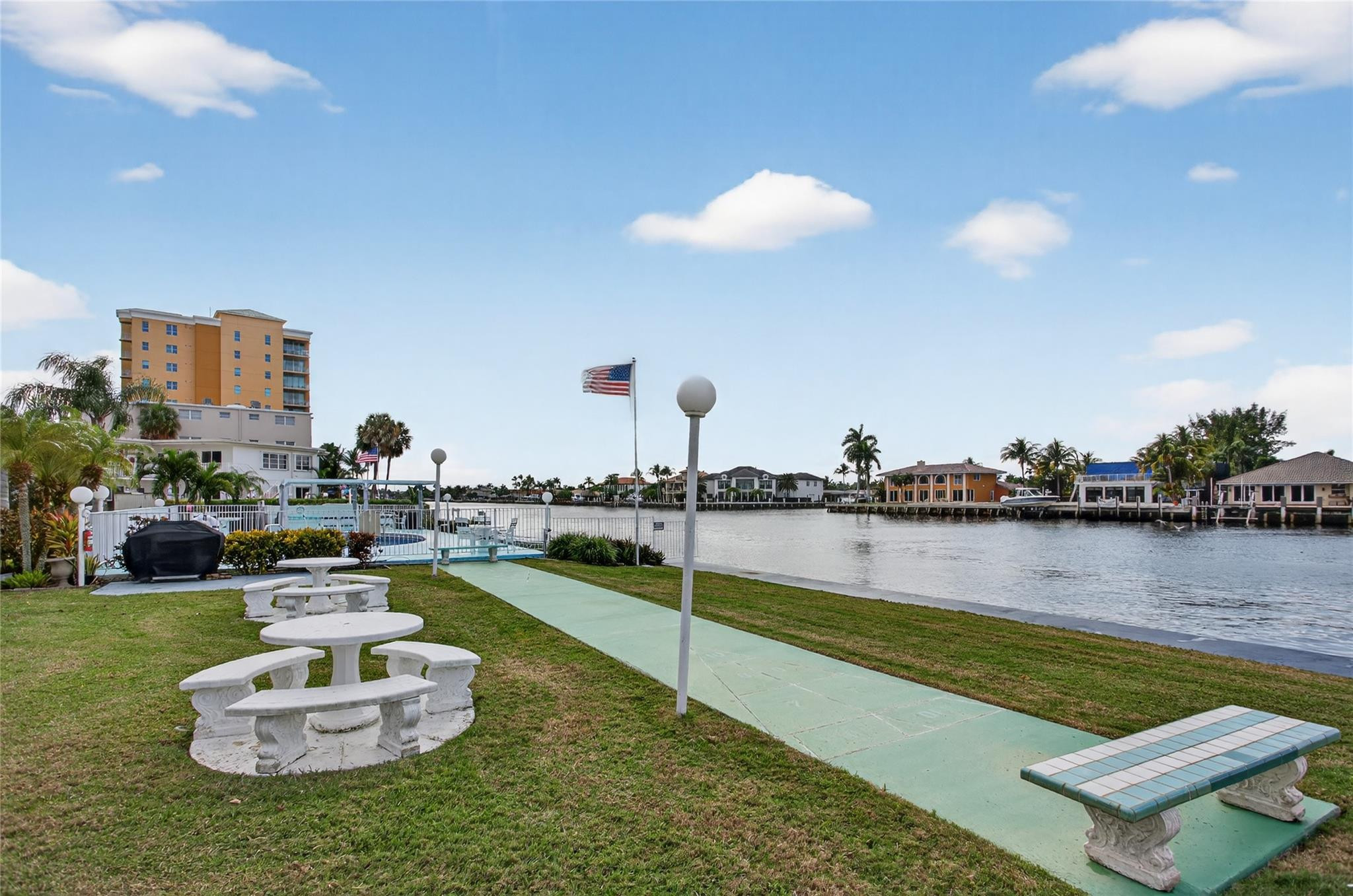1001 North Riverside Drive, Unit 305 Pompano Beach, FL 33062 - Photo 28 of 44 a view of a house with outdoor space and lake view