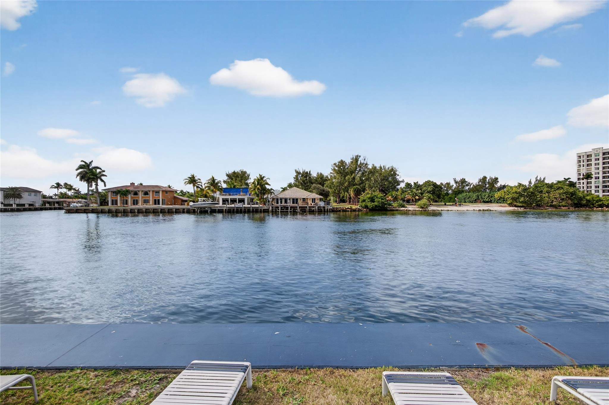1001 North Riverside Drive, Unit 305 Pompano Beach, FL 33062 - Photo 33 of 44 a view of a lake with houses