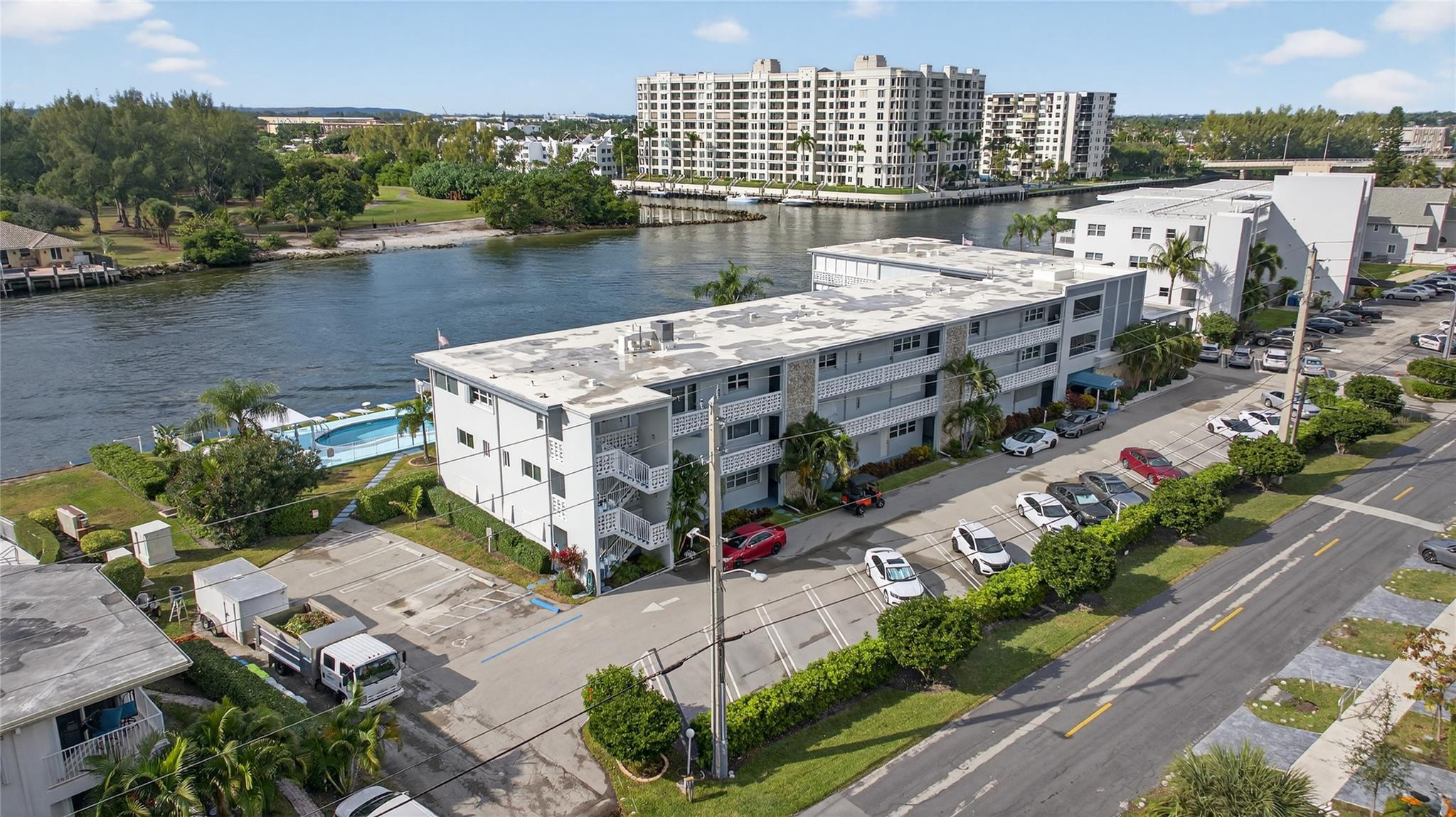 1001 North Riverside Drive, Unit 305 Pompano Beach, FL 33062 - Photo 35 of 44 a view of a lake with tall building in front of it